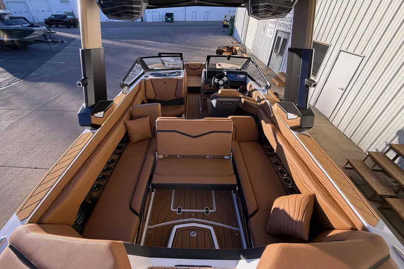 Slide: The Image of 2026 Nautique Super Air Nautique G25 interior with luxurious seating and modern design. - 24