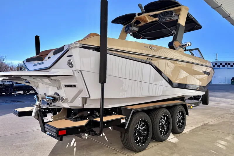 Slide: The Image of 2026 Nautique Super Air Nautique G25 boat on trailer, showcasing sleek design and modern features. - 7