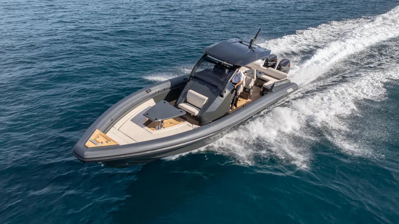 Slide: The Image of 2025 Skipper 38 boat cruising on open water, showcasing sleek design and powerful performance. - 40