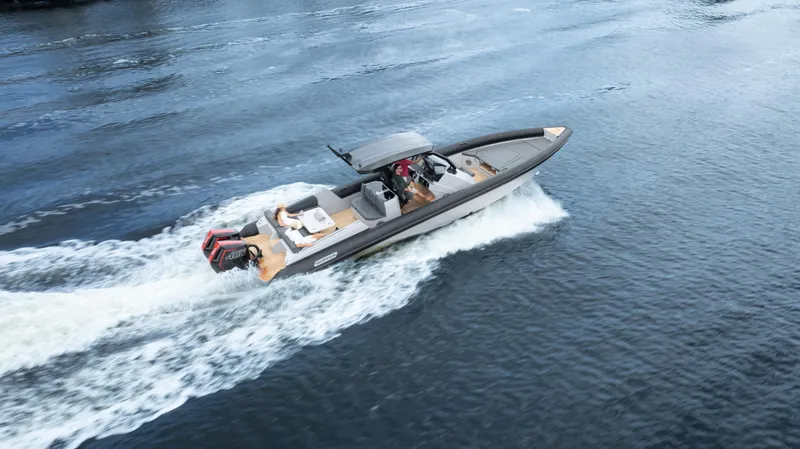 Slide: The Image of 2025 Skipper-BSK 38 boat cruising on open water, showcasing sleek design and speed. - 37