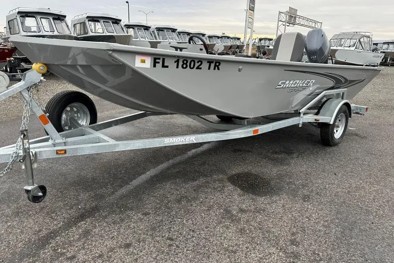 The Image of 2023 Smoker Craft Sportsman 1660 boat on trailer, parked in a lot. - 0