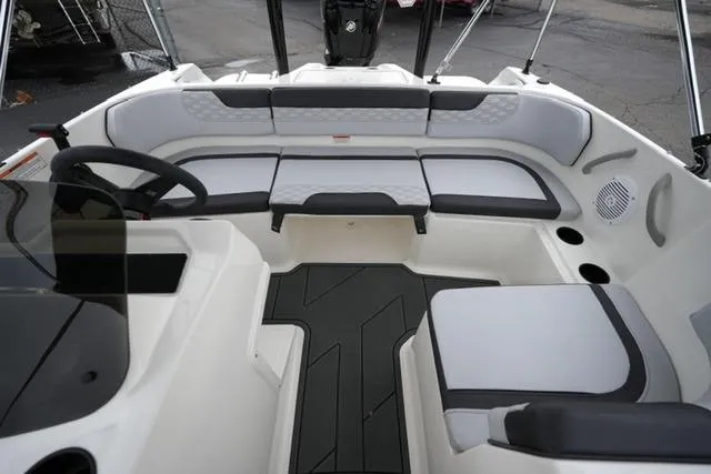 Slide: The Image of 2026 Bayliner M17 boat interior with modern seating and steering wheel. - 11