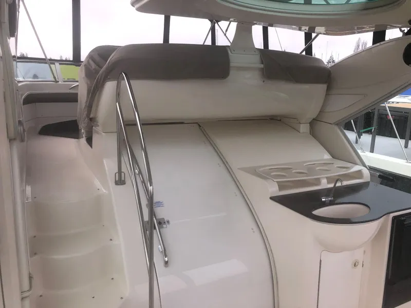 Slide: The Image of 2001 Maxum 4100 SCA yacht interior with seating and sink area. - 10