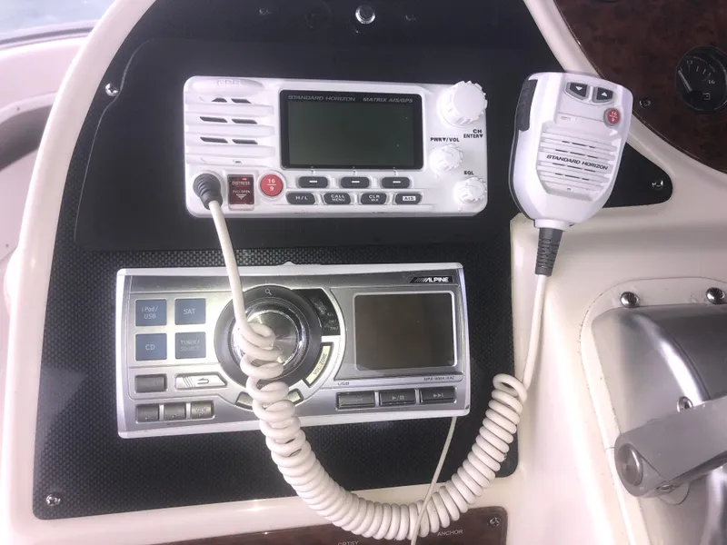 Slide: The Image of Control panel of a 2001 Maxum 4100 SCA boat with radio and communication equipment. - 15