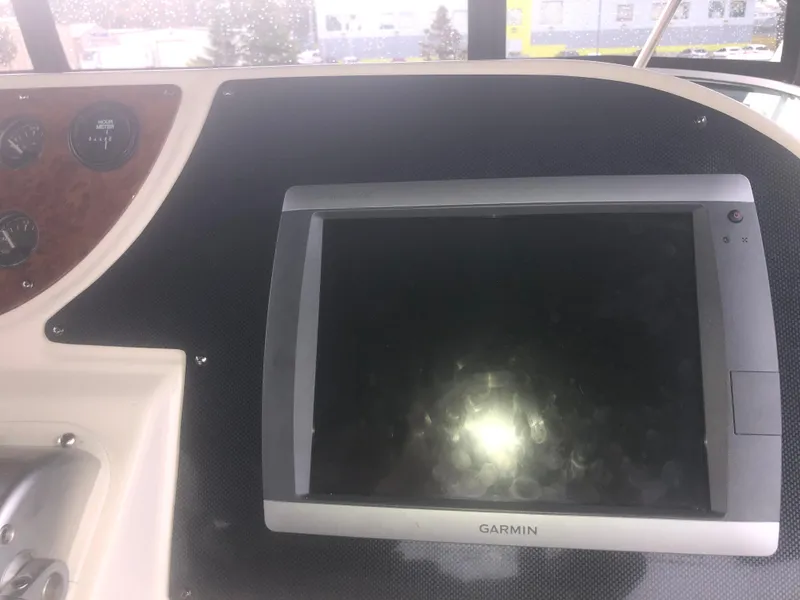 Slide: The Image of Garmin navigation system on 2001 Maxum 4100 SCA boat dashboard. - 17