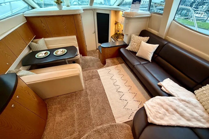 Slide: The Image of Luxurious interior of 2001 Maxum 4100 SCA yacht with cozy seating and elegant decor. - 20