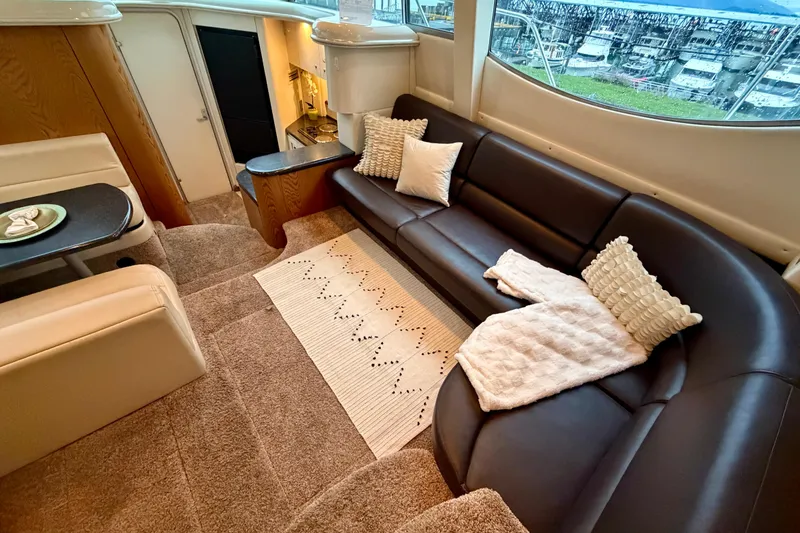 Slide: The Image of Luxurious interior of 2001 Maxum 4100 SCA yacht with plush seating and elegant decor. - 21