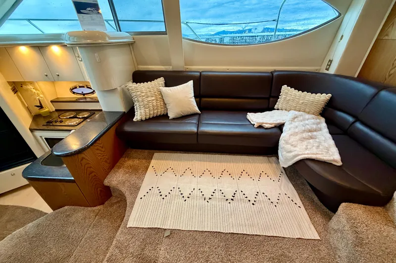 Slide: The Image of Luxurious interior of 2001 Maxum 4100 SCA yacht with cozy seating and modern kitchen. - 22