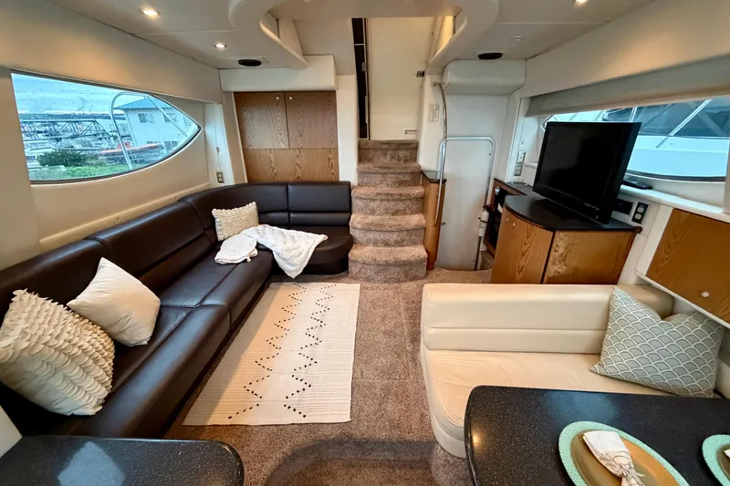 Slide: The Image of Luxurious interior of 2001 Maxum 4100 SCA yacht with plush seating and modern amenities. - 26