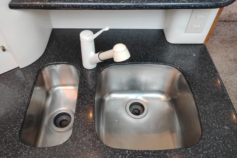 Slide: The Image of Stainless steel dual sink in 2001 Maxum 4100 SCA yacht kitchen. - 29