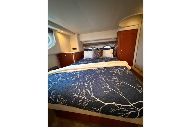 Slide: The Image of Luxurious bedroom interior of 2001 Maxum 4100 SCA yacht with elegant bedding. - 34