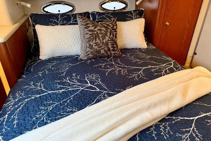 Slide: The Image of Luxurious bedroom interior of 2001 Maxum 4100 SCA yacht with elegant bedding and pillows. - 35