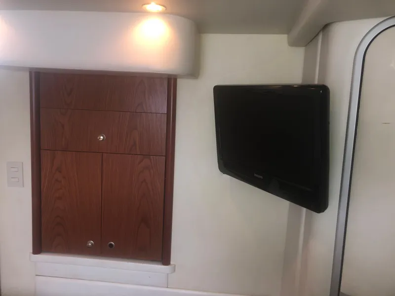 Slide: The Image of Interior of 2001 Maxum 4100 SCA yacht with TV and wooden cabinets. - 36