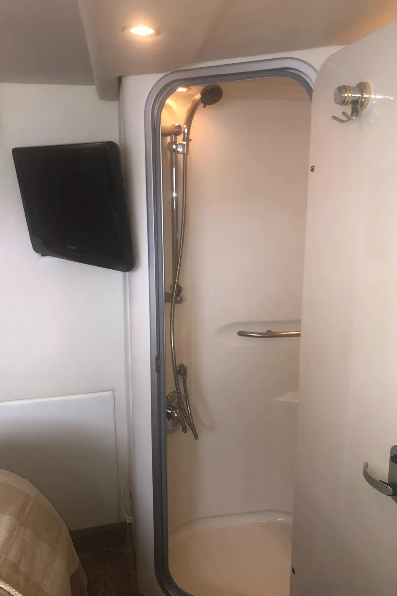 Slide: The Image of Shower area in 2001 Maxum 4100 SCA yacht with modern fixtures and lighting. - 38