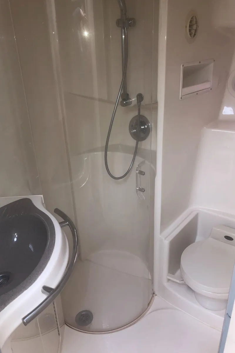 Slide: The Image of Bathroom in 2001 Maxum 4100 SCA yacht with shower, sink, and toilet. - 40