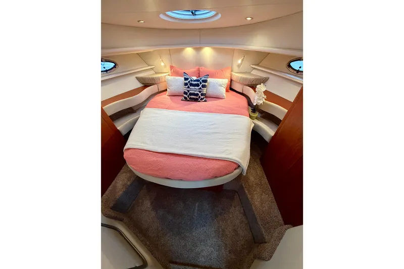 Slide: The Image of Luxurious cabin interior of 2001 Maxum 4100 SCA yacht with cozy bed and elegant decor. - 41