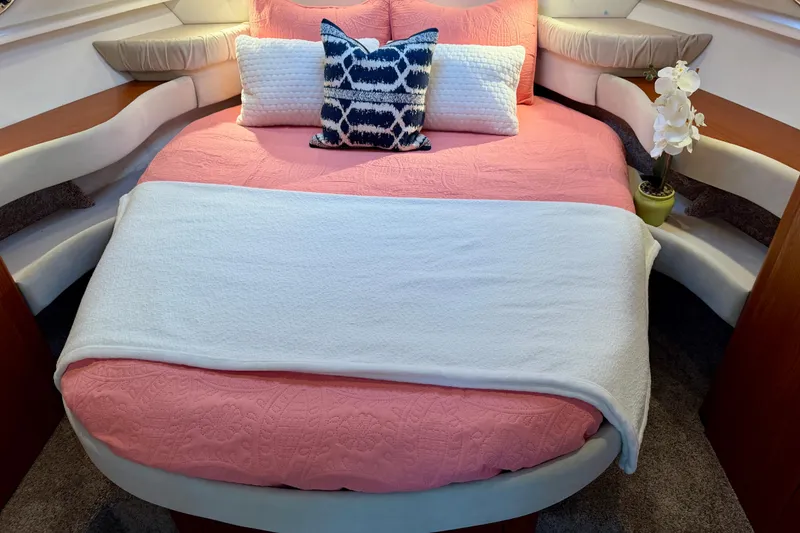 Slide: The Image of Luxurious bedroom interior of 2001 Maxum 4100 SCA yacht with pink bedding and decorative pillows. - 42