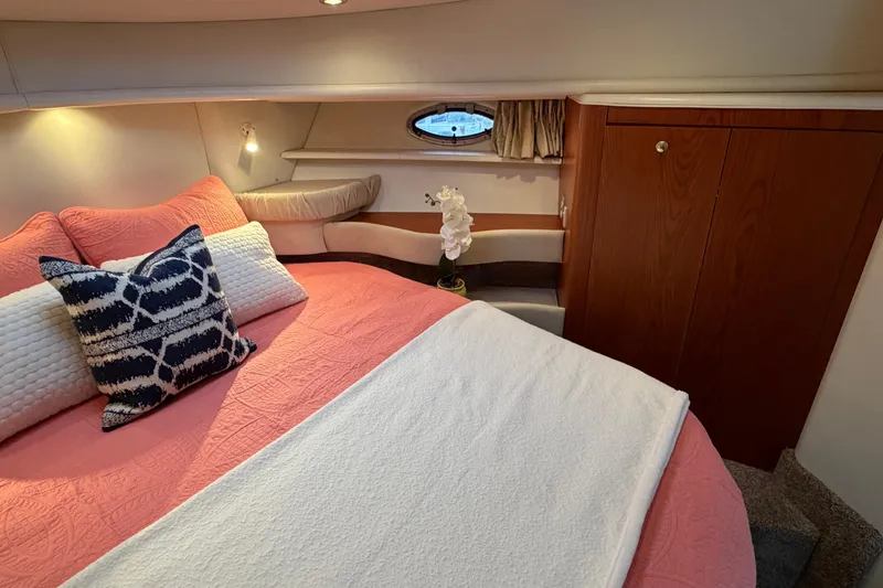 Slide: The Image of Luxurious cabin interior of 2001 Maxum 4100 SCA yacht with cozy bedding and elegant decor. - 44