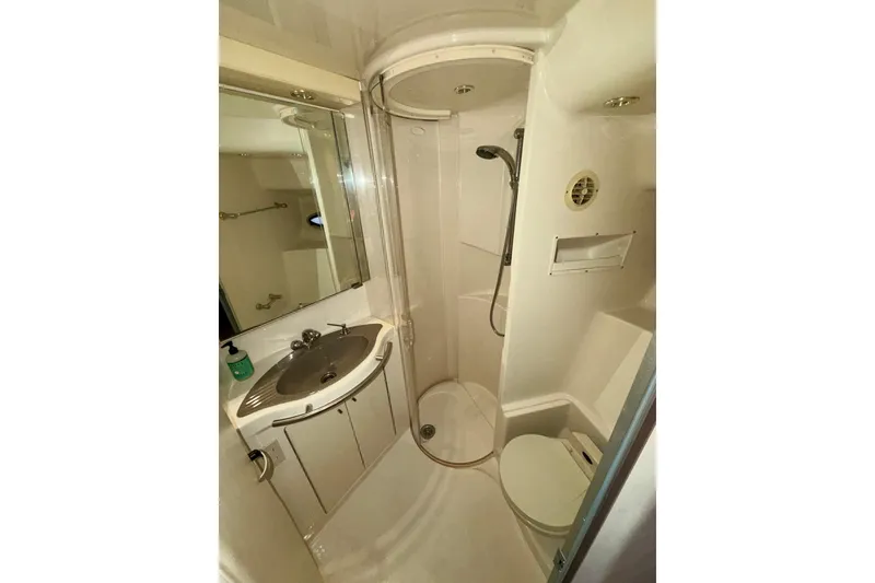 Slide: The Image of 2001 Maxum 4100 SCA yacht bathroom with shower, sink, and toilet. - 46