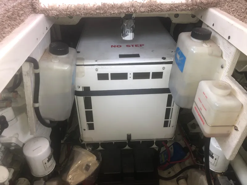 Slide: The Image of Engine compartment of a 2001 Maxum 4100 SCA boat with labeled components and storage tanks. - 50