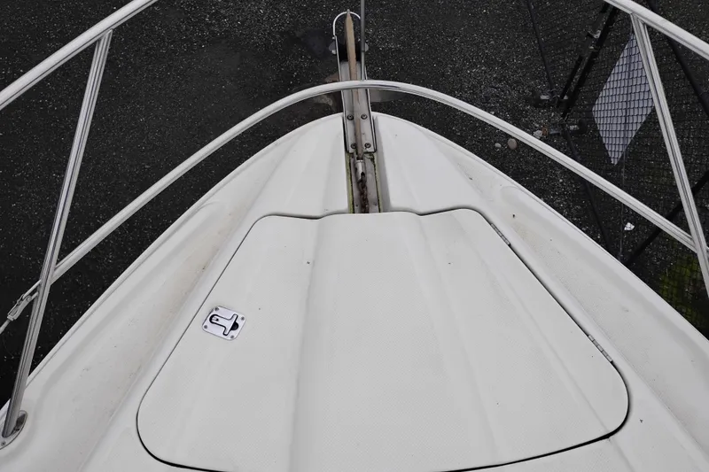 Slide: The Image of Bow view of 2001 Maxum 4100 SCA yacht, featuring sleek white deck design. - 53