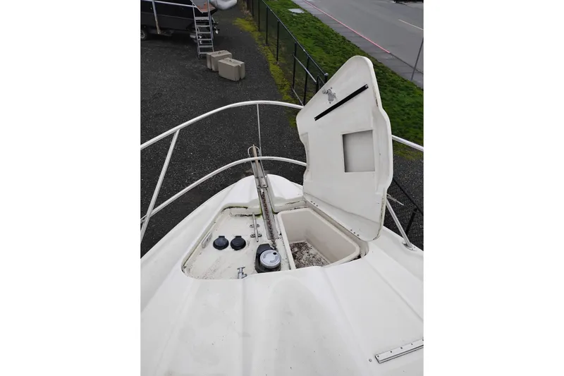 Slide: The Image of 2001 Maxum 4100 SCA boat deck with open storage compartment. - 54