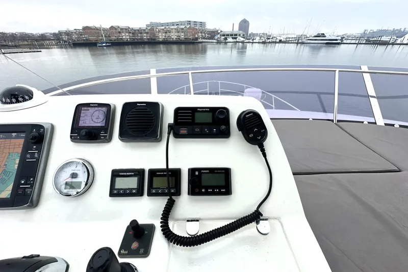 Slide: The Image of Control panel of a 2017 Prestige 500 yacht overlooking a marina. - 26