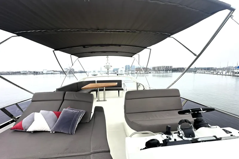 Slide: The Image of Luxurious 2017 Prestige 500 yacht interior with spacious seating and scenic waterfront view. - 3