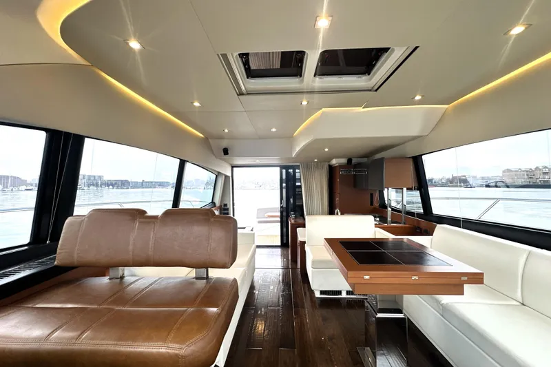 Slide: The Image of Luxurious interior of a 2017 Prestige 500 yacht with modern seating and panoramic windows. - 30