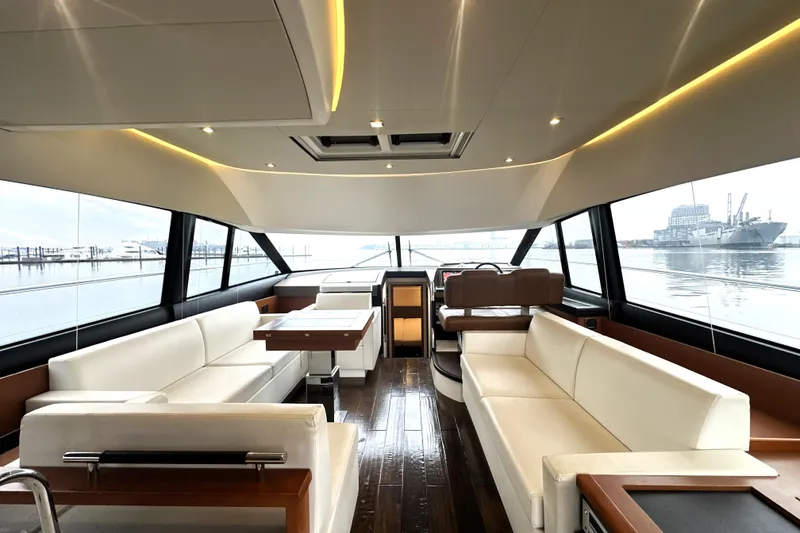Slide: The Image of Luxurious interior of 2017 Prestige 500 yacht with elegant seating and panoramic windows. - 37