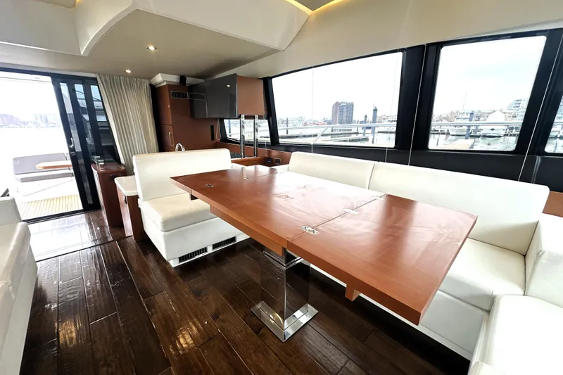 Slide: The Image of Luxurious interior of 2017 Prestige 500 yacht with elegant wood and white seating. - 4