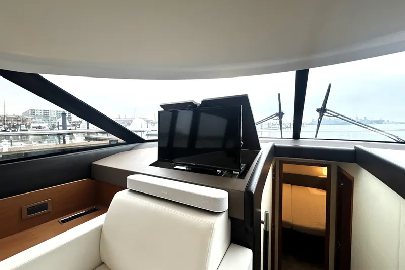Slide: The Image of Interior of 2017 Prestige 500 yacht with TV and luxurious seating. - 43