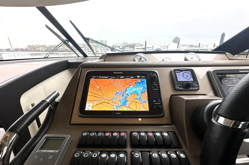 Slide: The Image of Cockpit of 2017 Prestige 500 yacht with navigation system and controls. - 49