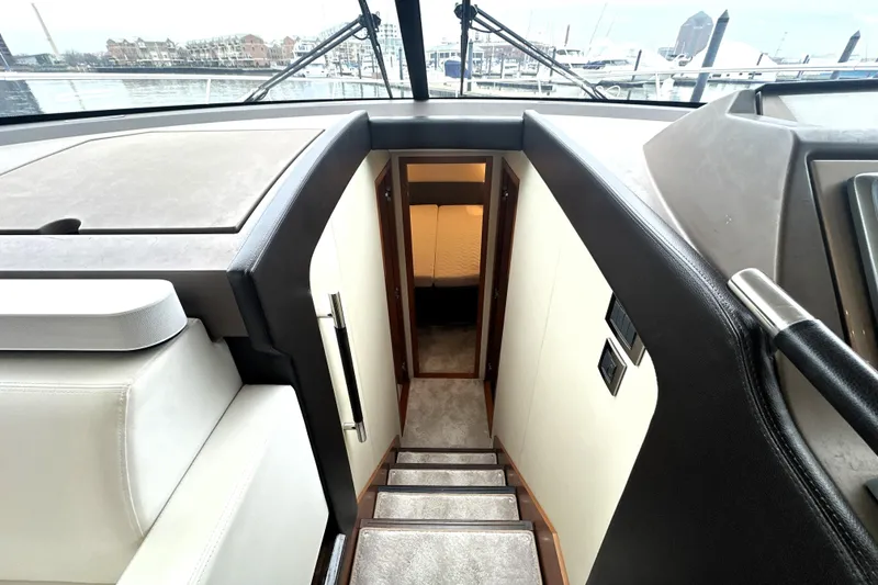Slide: The Image of Interior view of 2017 Prestige 500 yacht, showing stairs leading to cabin. - 51