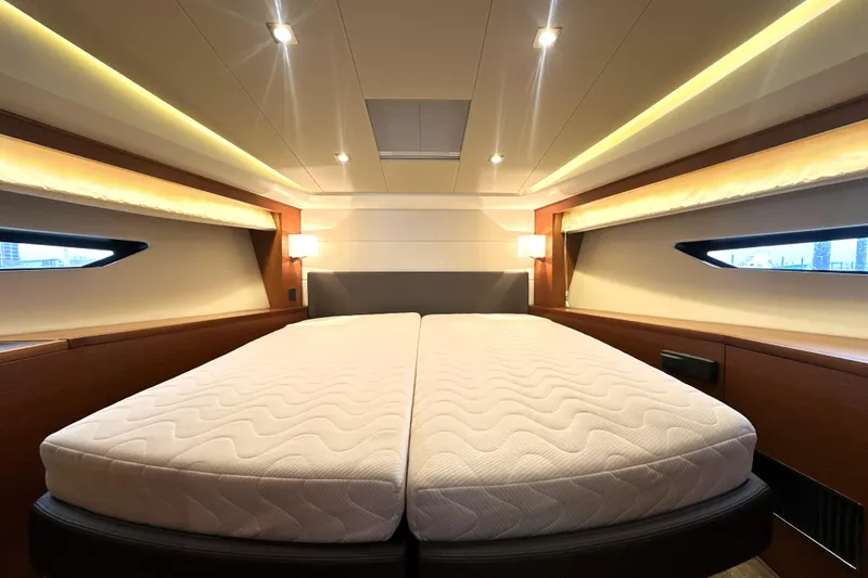 Slide: The Image of Luxurious bedroom interior of 2017 Prestige 500 yacht with modern lighting and comfortable bedding. - 52