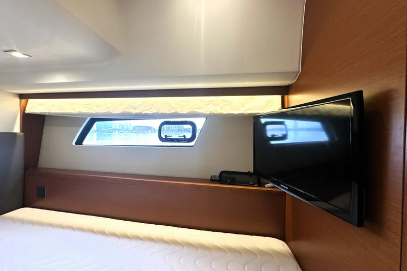 Slide: The Image of Luxurious cabin interior of 2017 Prestige 500 yacht with window and mounted TV. - 58