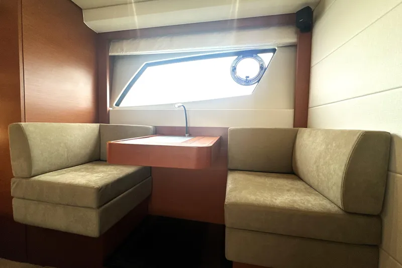 Slide: The Image of Luxurious interior of 2017 Prestige 500 yacht with cozy seating and modern window design. - 65