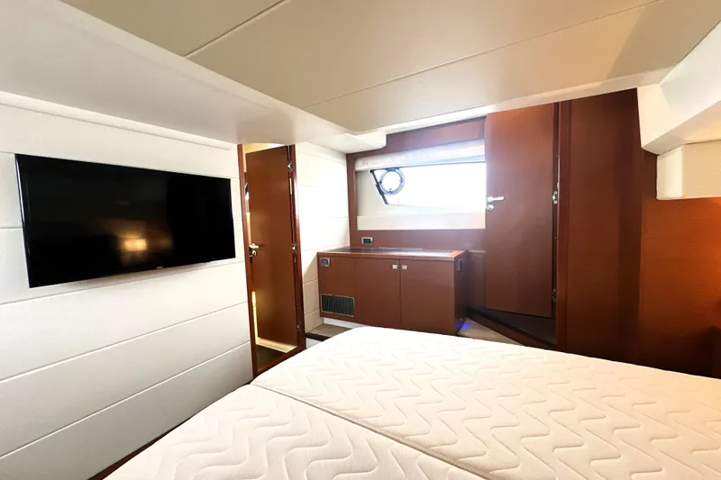 Slide: The Image of Luxurious interior of 2017 Prestige 500 yacht with TV and modern furnishings. - 66