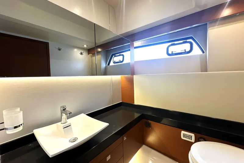 Slide: The Image of Luxurious bathroom interior of 2017 Prestige 500 yacht with modern sink and window. - 68