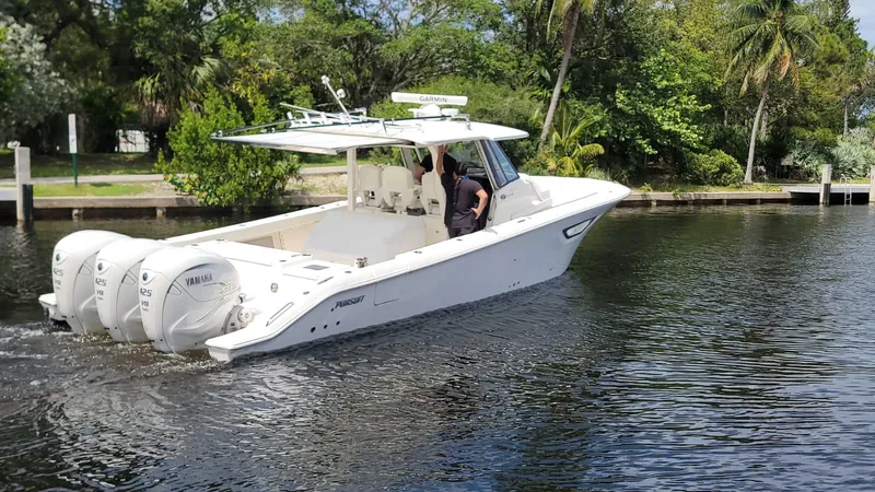 Slide: The Image of 2021 Pursuit S 378 Sport boat cruising on a calm river. - 10