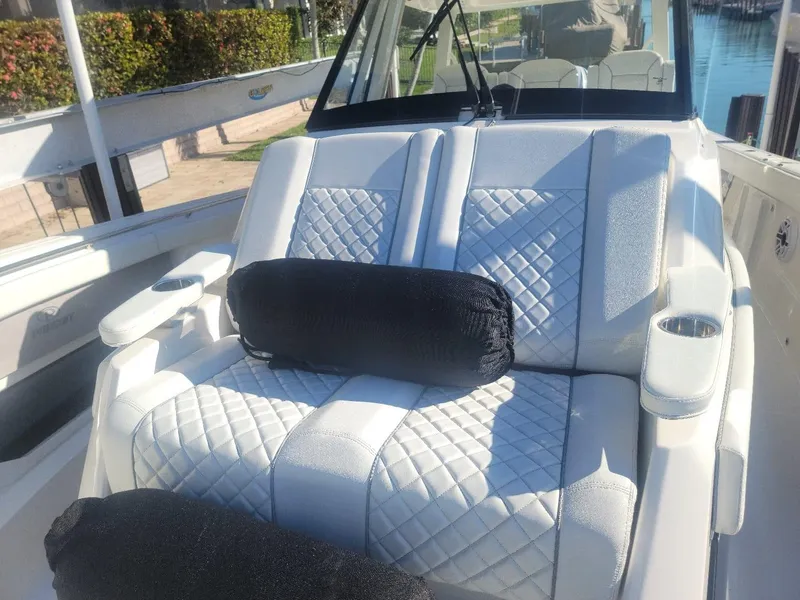 Slide: The Image of 2021 Pursuit S 378 Sport boat with luxurious white quilted seating. - 24