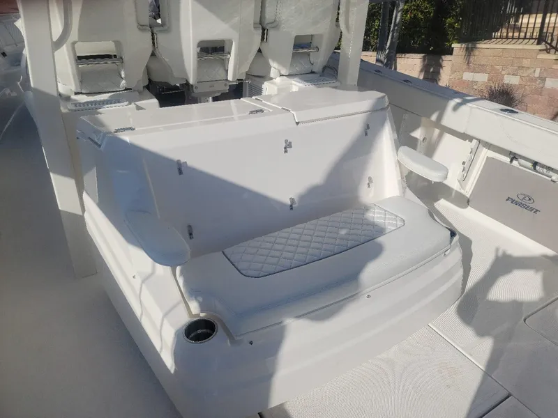 Slide: The Image of 2021 Pursuit S 378 Sport boat interior with seating and storage. - 29