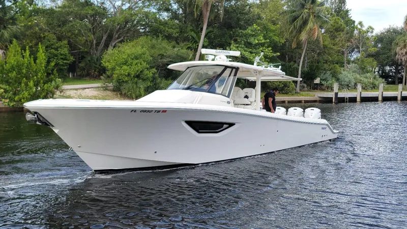 Slide: The Image of 2021 Pursuit S 378 Sport boat cruising on a calm river. - 3