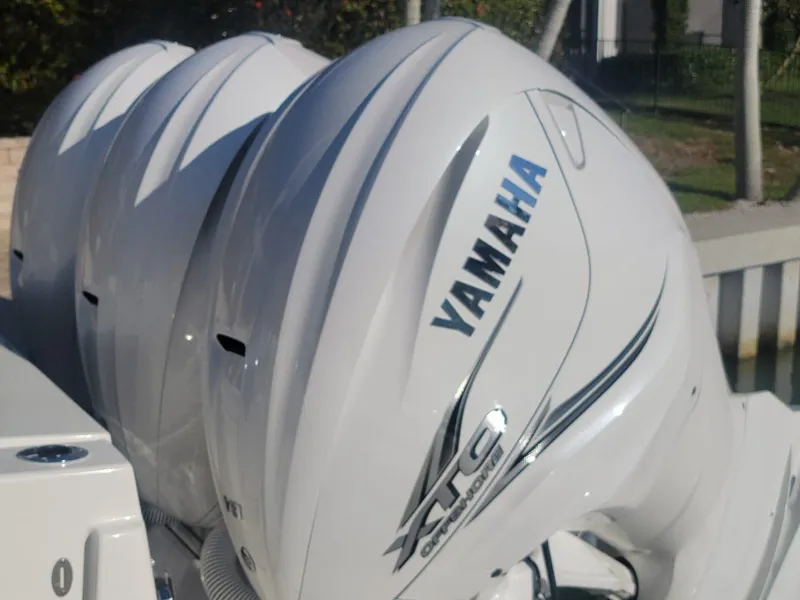 Slide: The Image of Yamaha outboard engines on a 2021 Pursuit S 378 Sport boat. - 34