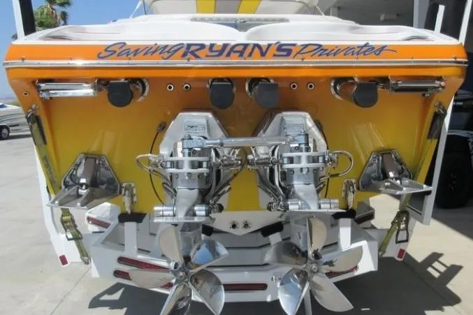 Slide: The Image of 2013 Nordic 39 POKER RUN boat with dual propellers and custom graphics. - 4