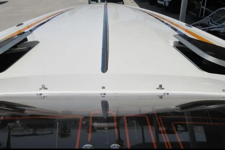 Slide: The Image of 2013 Nordic 39 POKER RUN boat, top view, sleek design with orange accents. - 7