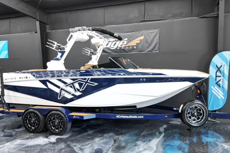 The Image of 2024 ATX Surf Boats 22 Type-S displayed indoors on a trailer. - 0