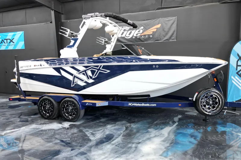 Slide: The Image of 2024 ATX Surf Boats 22 Type-S on display in showroom, featuring sleek design and modern features. - 13