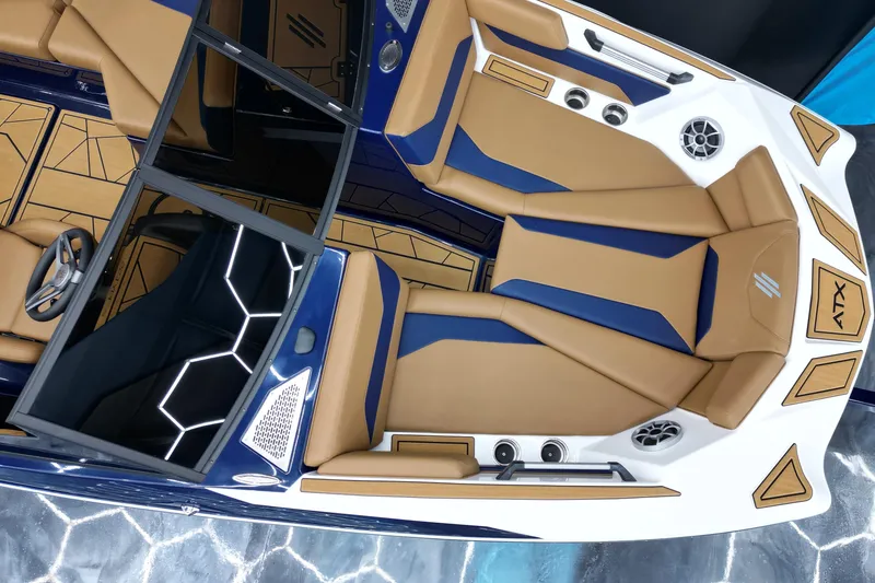 Slide: The Image of 2024 ATX Surf Boats 22 Type-S interior with tan and blue seating, modern design. - 6