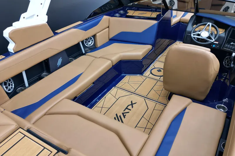 Slide: The Image of 2024 ATX Surf Boats 22 Type-S interior with tan and blue seating, modern design. - 8